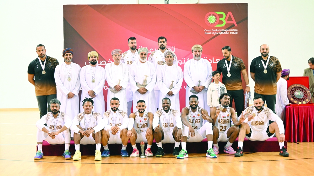 Runner-ups Al Bashayer players pose with their medals.