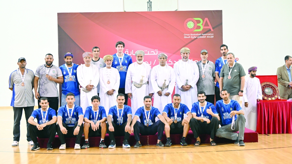 Nizwa players with their bronze medals.