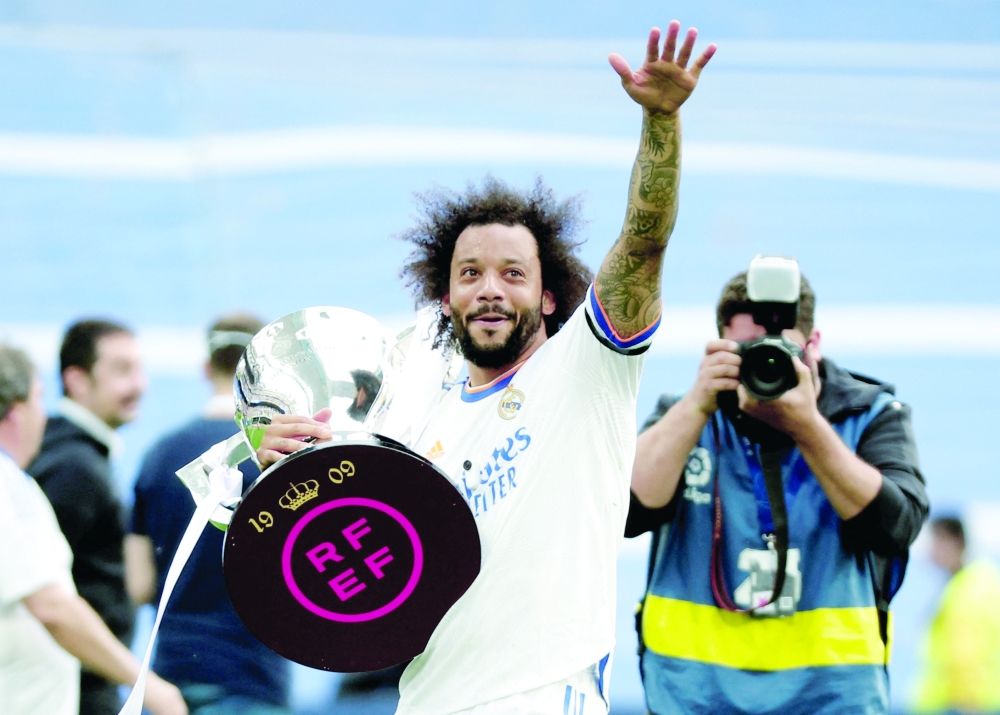 FILE PHOTO: Soccer Football - LaLiga - Real Madrid v Espanyol - Santiago Bernabeu, Madrid, Spain - April 30, 2022 Real Madrid's Marcelo holds the trophy and celebrates after winning LaLiga.