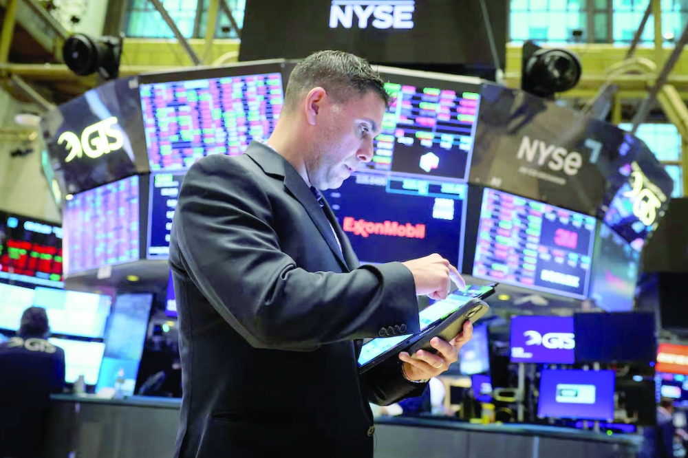 Traders work on the floor at the New York Stock Exchange (NYSE) in New York City, US. — Reuters