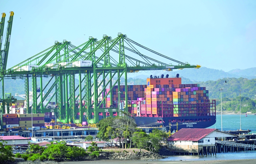 A cargo ship waits at Balboa port before crossing the Panama Canal in Panama City. — AFP