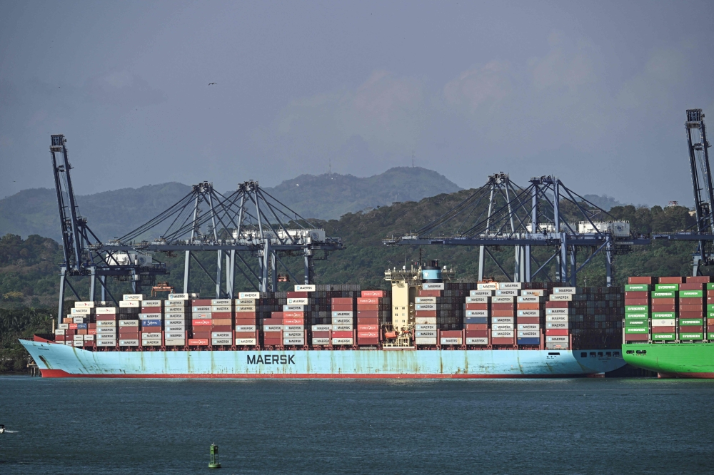 A cargo ship waits at Balboa port before crossing the Panama Canal i