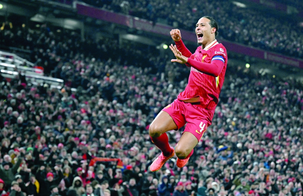 Liverpool's Virgil van Dijk celebrates scoring their fourth goal.