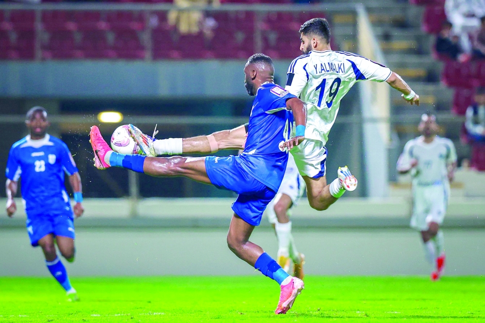 Al Shabab and Al Nasr players fight for the ball.