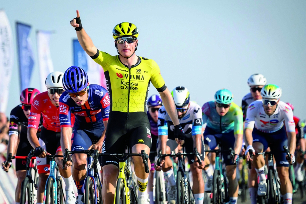 Olav Kooij celebrates after crossing the finish line. — AFP