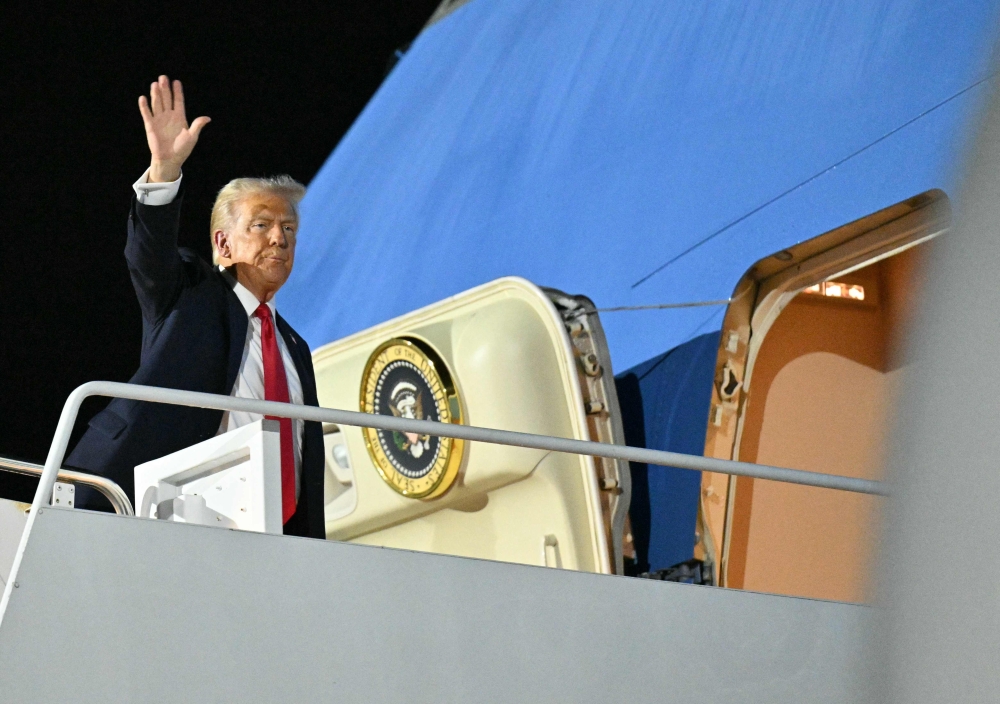 US President Donald Trump boards Air Force One 
