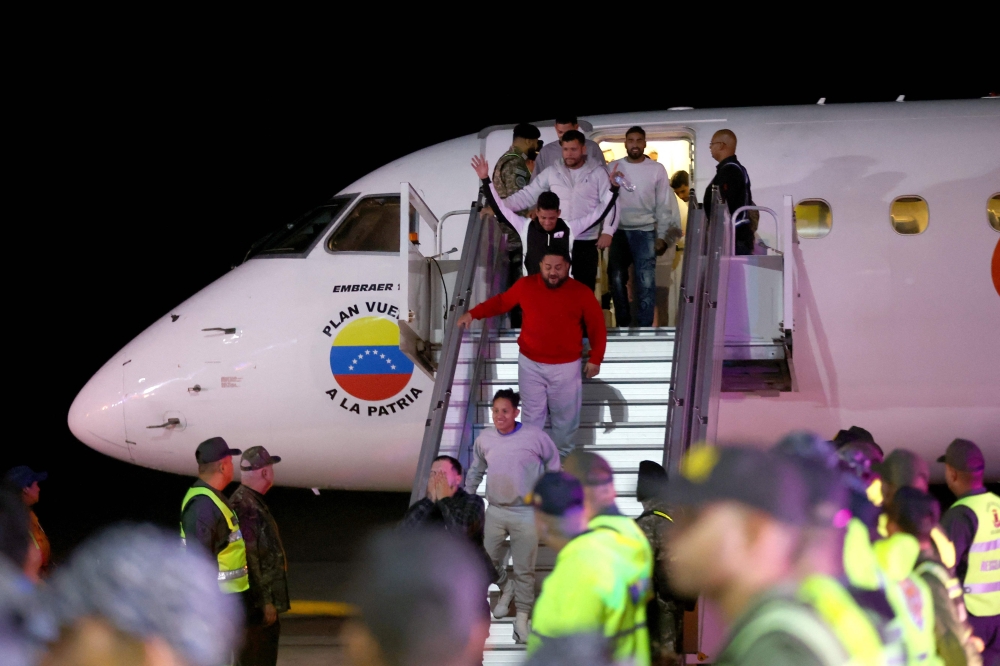 Venezuelan migrants deported from US arrive at Simon Bolivar international airport in Maiquetia, Venezuela on February 10, 2025. Venezuela sent two planes on February 10 to bring nearly 200 undocumented migrants back from the United States, saying it hoped for a "new beginning" in ties with Washington, which does not recognize Nicolas Maduro as the legitimate president. (Photo by Pedro MATTEY / AFP)