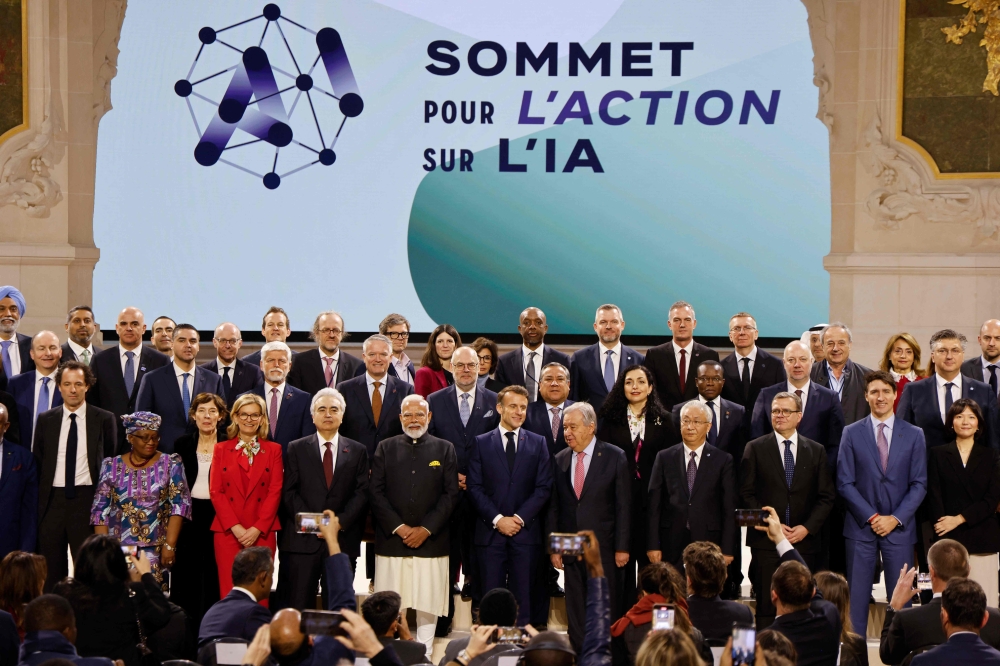 World leaders and attendees pose for a group picture at the end of the plenary session of the Artificial Intelligence (AI) Action Summit, at the Grand Palais, in Paris. — AFP 