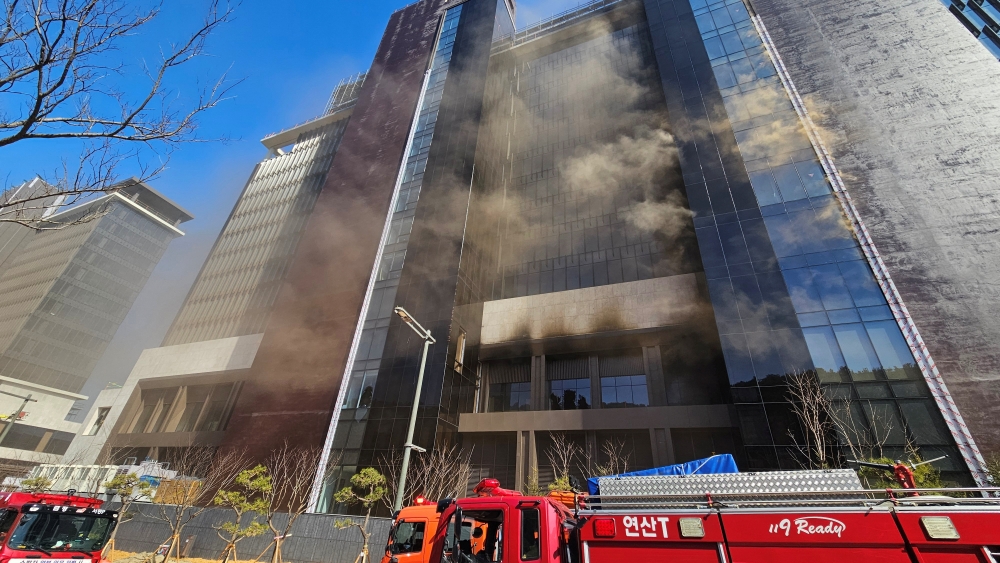 Smoke rises from a building which is currently under construction in Busan, South Korea, 