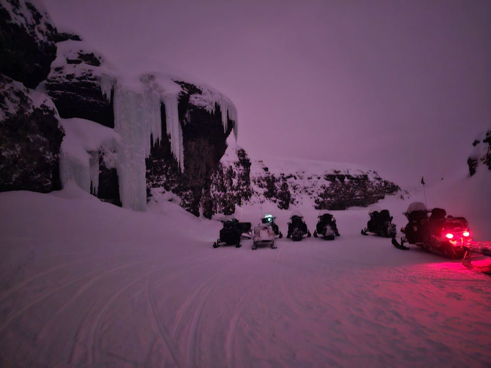 Snowmobiles getting ready to roll