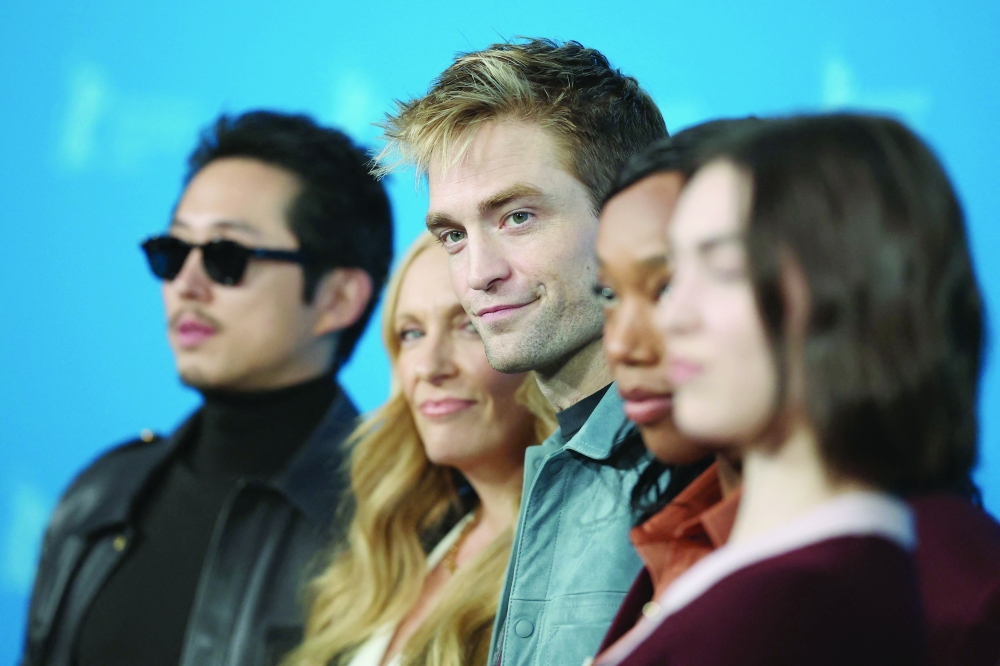 (L-R) US actor Steven Yeun, Australian actress Toni Collette, English actor Robert Pattinson and English actress Naomi Ackie pose during a photo call for the film 'Mickey 17' presented as Berlinale Special Gala at the 75th Berlinale, Europe's first major film festival of the year, in Berlin on February 15, 2025.
