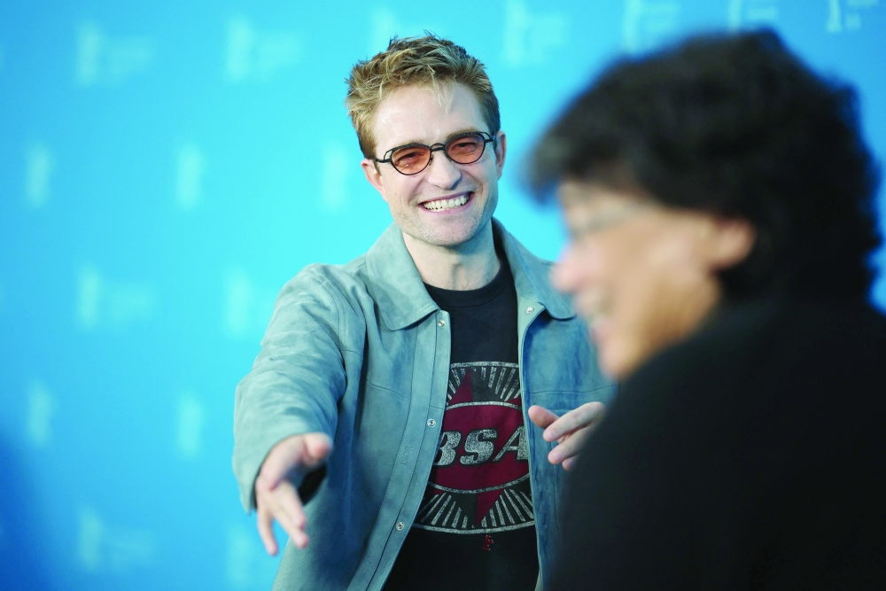 English actor Robert Pattinson (L) and South Korean director Bong Joon Ho pose during a photo call for the film 'Mickey 17' presented as Berlinale Special Gala at the 75th Berlinale, Europe's first major film festival of the year, in Berlin on February 15, 2025.