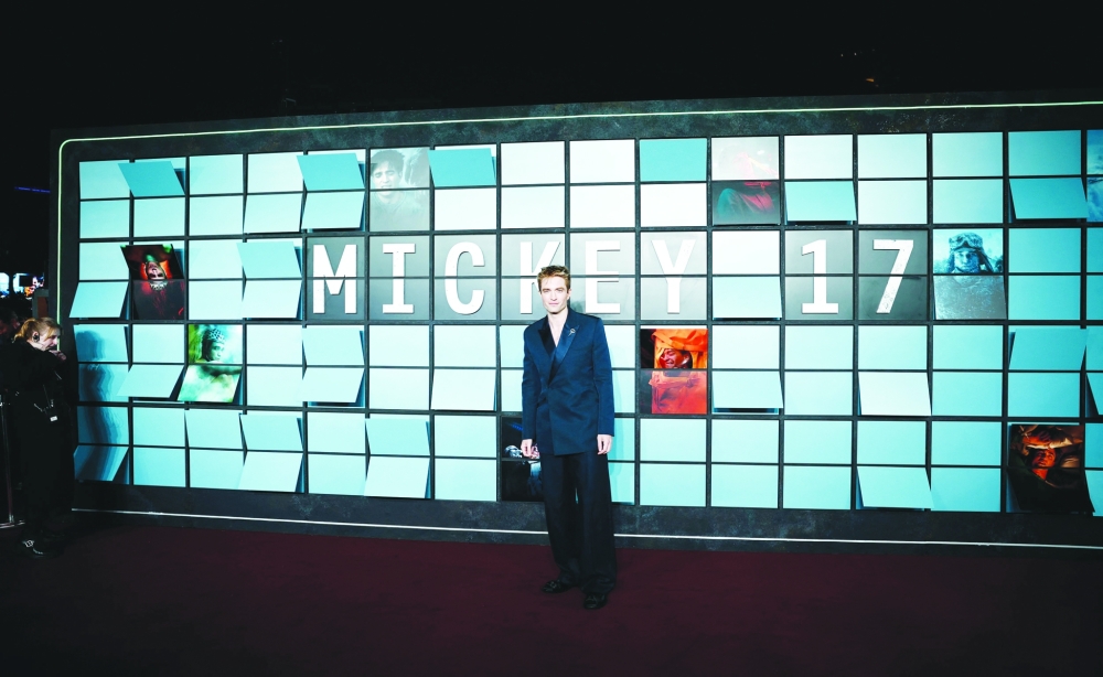 English actor Robert Pattinson poses upon arrival for the World premiere of the film "Mickey 17" in Leicester Square in central London on February 13, 2025.