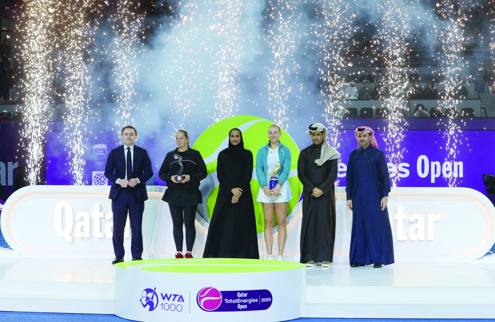 Winner Amanda Anisimova of the US and runner up Latvia's Jelena Ostapenko pose with their trophies after the final alongside President of the Qatar Tennis Federation Nasser al Khelaifi.— Reuters
