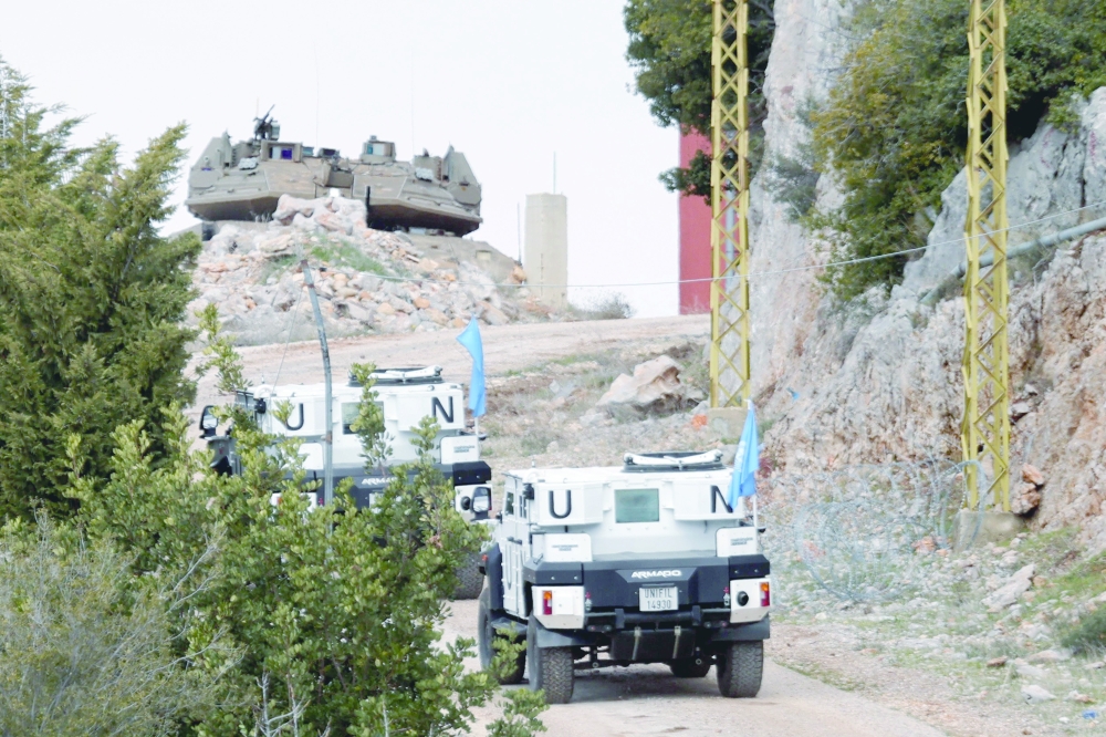 A photo from the southern Lebanese area of Marjayoun shows UNIFIL forces driving towards an Israeli army position. — AFP