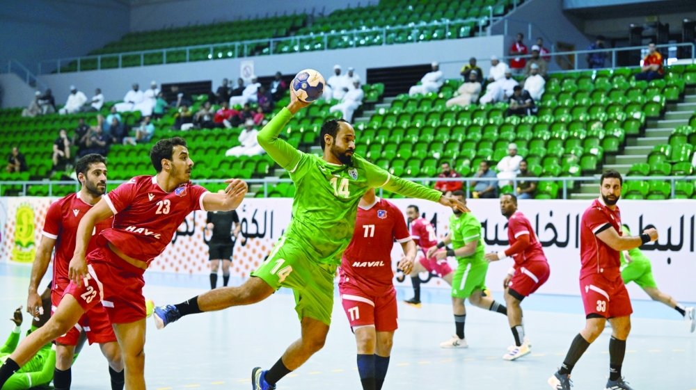 Kuwait SC and Dibba Al Huson players in action.