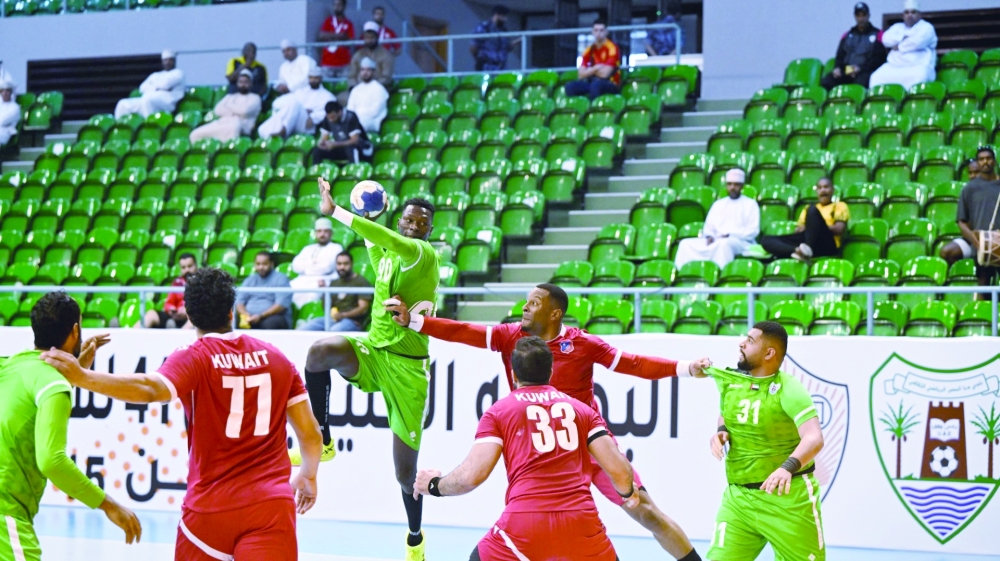 Kuwait SC and Dibba Al Huson players in action.