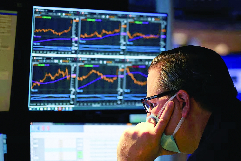 A trader works on the trading floor on the last day of trading before Christmas at the New York Stock Exchange (NYSE) in Manhattan, New York City, US. — Reuters