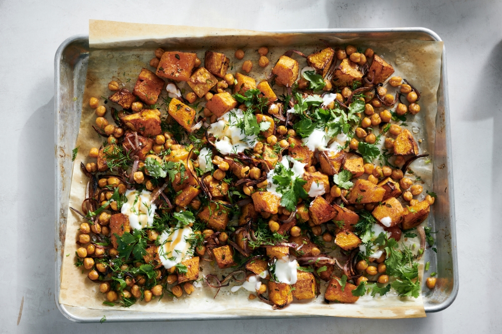 Roasted honey nut squash and chickpeas with hot honey. food stylist: Simon Andrews (David Malosh/The New York Times)
