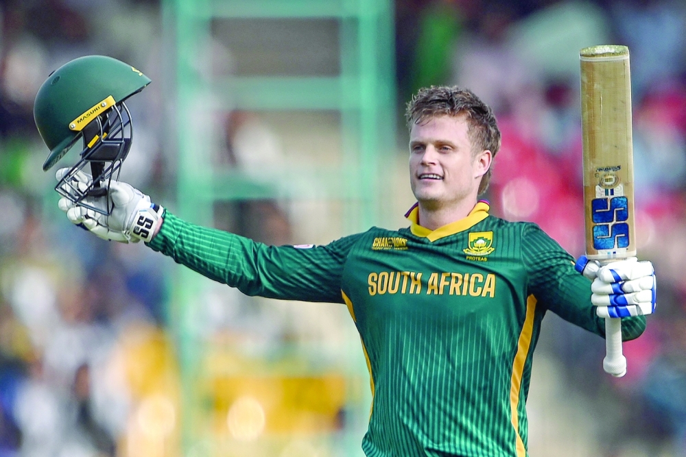 South Africa's Ryan Rickelton celebrates after scoring a century (100 runs) during the ICC Champions Trophy one-day international (ODI) cricket match between Afghanistan and South Africa at the National Stadium in Karachi on February 21, 2025.  (Photo by Rizwan TABASSUM / AFP)