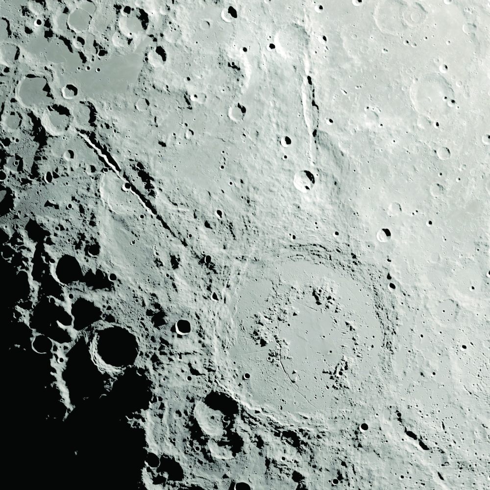 Two grand canyons on the moon radiating from the Schr