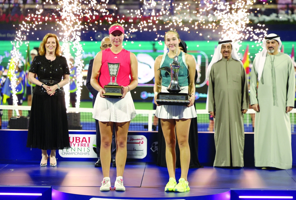 Russia's Mirra Andreeva poses for a picture with the trophy after winning the final alongside runner up Denmark's Clara Tauson.— Reuters