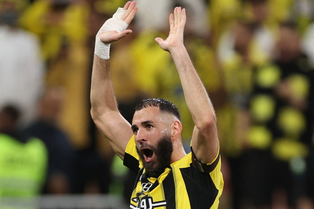 Ittihad's French forward Karim Benzema greets the fans after the match between Al Ittihad and Al Hilal at King Abdullah Sports City in Jeddah.— AFP