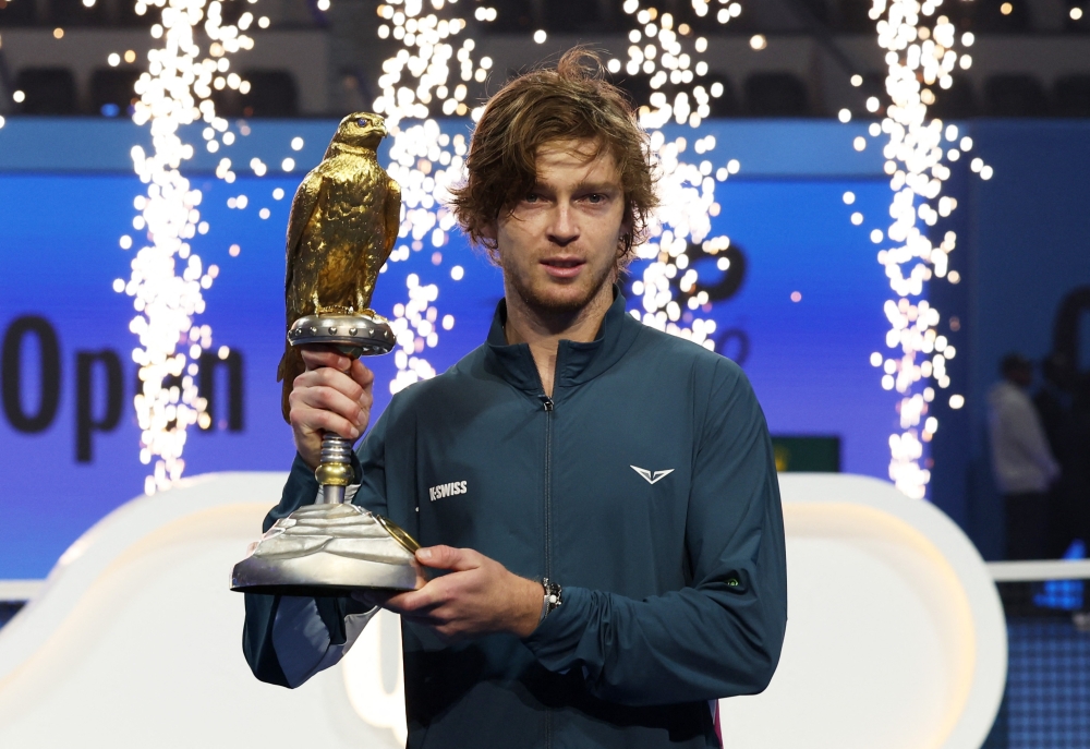 Russia's Andrey Rublev celebrates with the trophy after winning the final against Britain's Jack Draper.— Reuters