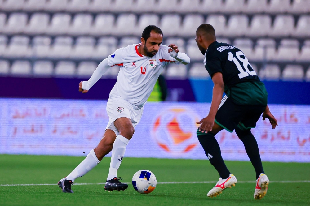 Oman and the UAE players in action.
