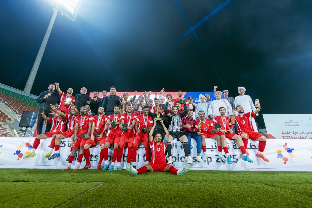 The Royal Court Affairs (RCA) players celebrate with the trophy.