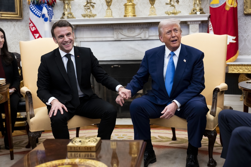 President Emmanuel Macron of France, left, and President Donald Trump meet in the Oval Office of the White House in Washington, on Monday, Feb, 24, 2025. (Doug Mills/The New York Times)