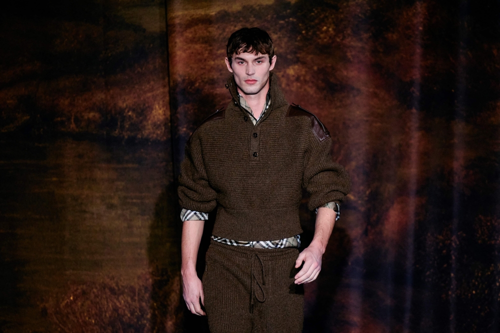 A model presents a creation from Burberry 's Womenswear Fall-Winter 2025-2026 fashion show collection, during London Fashion Week, in London, on February 24, 2025. (Photo by BENJAMIN CREMEL / AFP)

