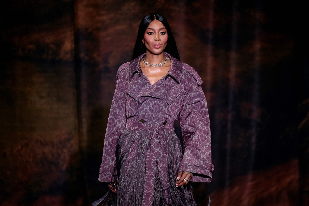 British model Naomi Campbell presents a creation from Burberry 's Womenswear Fall-Winter 2025-2026 fashion show collection, during London Fashion Week, in London, on February 24, 2025. (Photo by BENJAMIN CREMEL / AFP)

