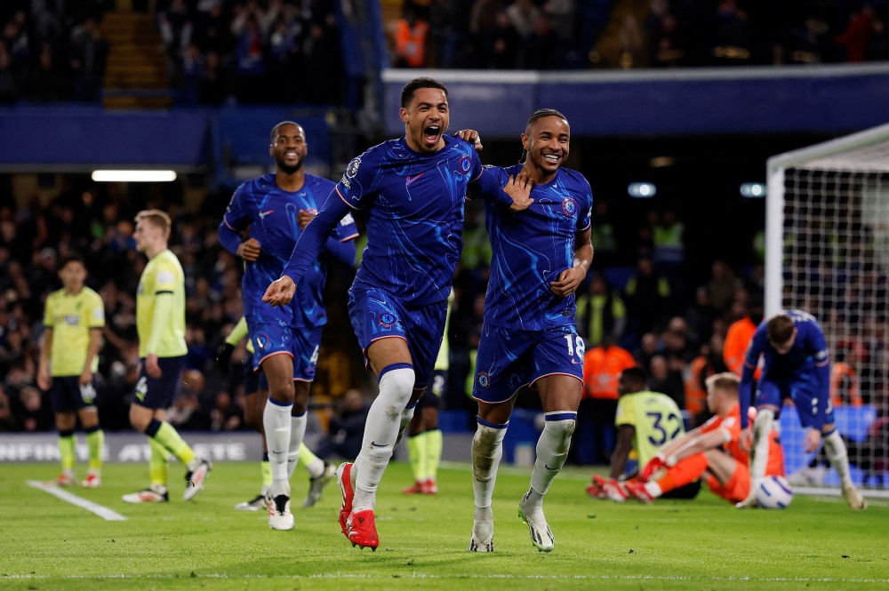 Chelsea's Colwill celebrates goal with Nkunku. — Reuters