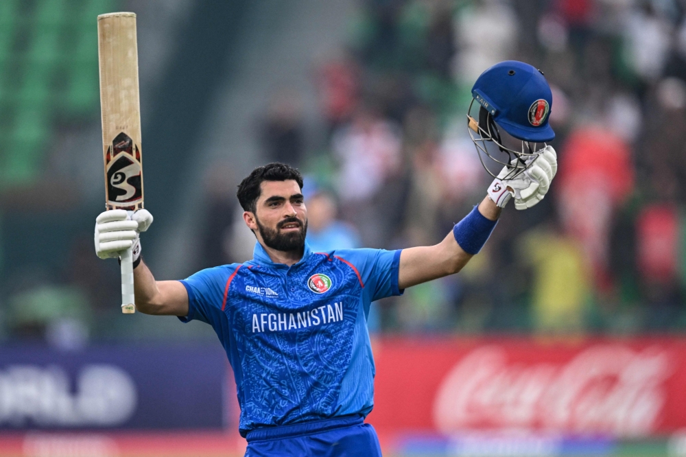 Ibrahim Zadran celebrates after scoring a century (100 runs) during the ICC Champions Trophy at the Gaddafi Stadium in Lahore on Wednesday. — AFP