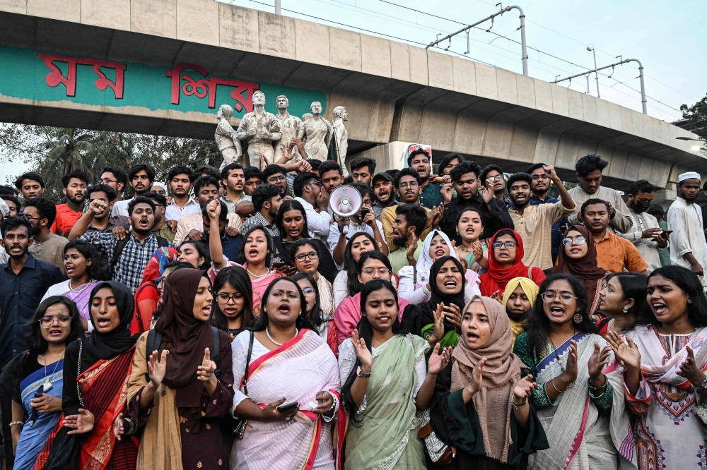 Student protesters shout slogans as they march along a street after unveiling a political party called 'Bangladesh Gonotantrik Chhatra Sangsad' in Dhaka. - AFP