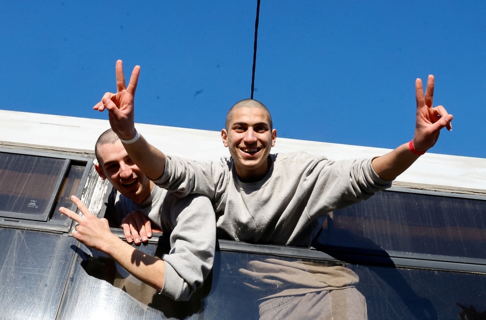 Freed Palestinian prisoners react after being released from an Israeli jail as part of a hostages-prisoners swap and a ceasefire deal in Gaza between Hamas and Israel, in Khan Younis in the southern Gaza Strip, February 27, 2025. REUTERS/Hatem Khaled     TPX IMAGES OF THE DAY