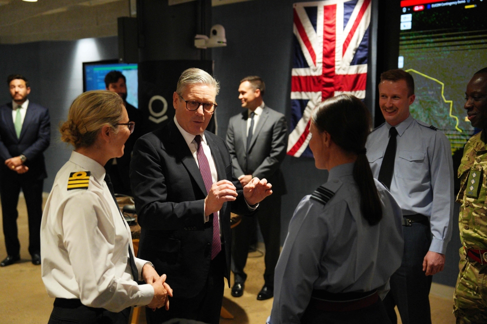British Prime Minister Keir Starmer tours Palantir Technologies headquarters with company employees and British military personnel in Washington, DC. — AFP