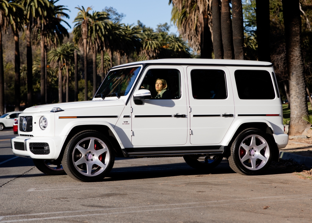 Jessica Hart, an Australian model and founder of LUMABeauty, and her Mercedes-Benz G-Wagen, a prized AMG G 63 version from the makers performance division, at Elysian Park in Los Angeles, Jan 21, 2025. (Alex Welsh/The New York Times)