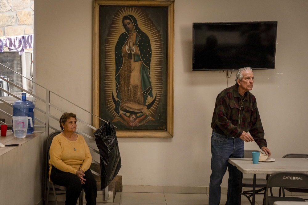 Rev. William Morton, right, a missionary at a cathedral that feeds migrants in Ciudad Juárez, Mexico, Feb. 28, 2025. (Alejandro Cegarra/The New York Times)