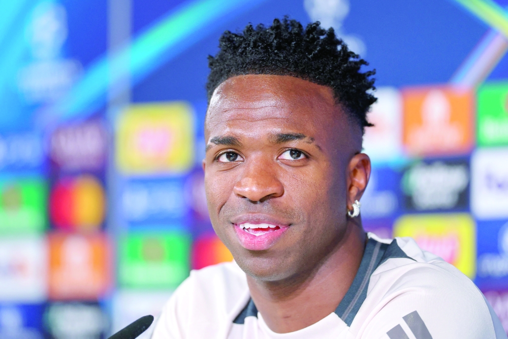 Real Madrid's Brazilian forward Vinicius Juniori attends a press conference on the eve of the UEFA Champions League Round of 16 first leg football match between Real Madrid CF and Club Atletico de Madrid at Real Madrid Sports City in Valdebebas. — AFP