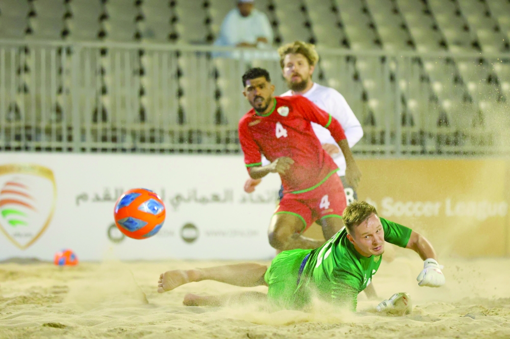 An Oman player shoots at the Russian goal.