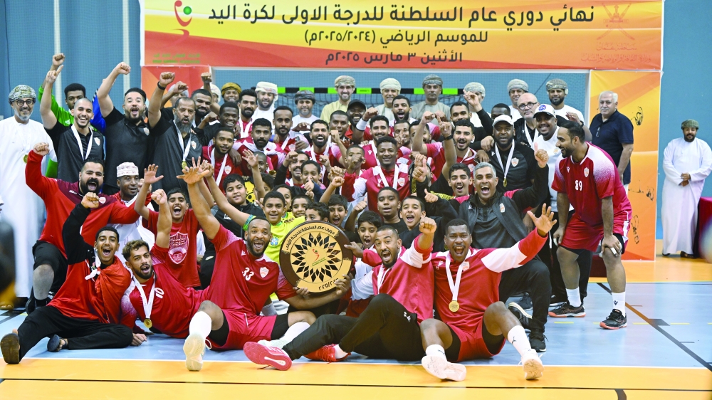 Champions Oman Club celebrate with the league shield.
