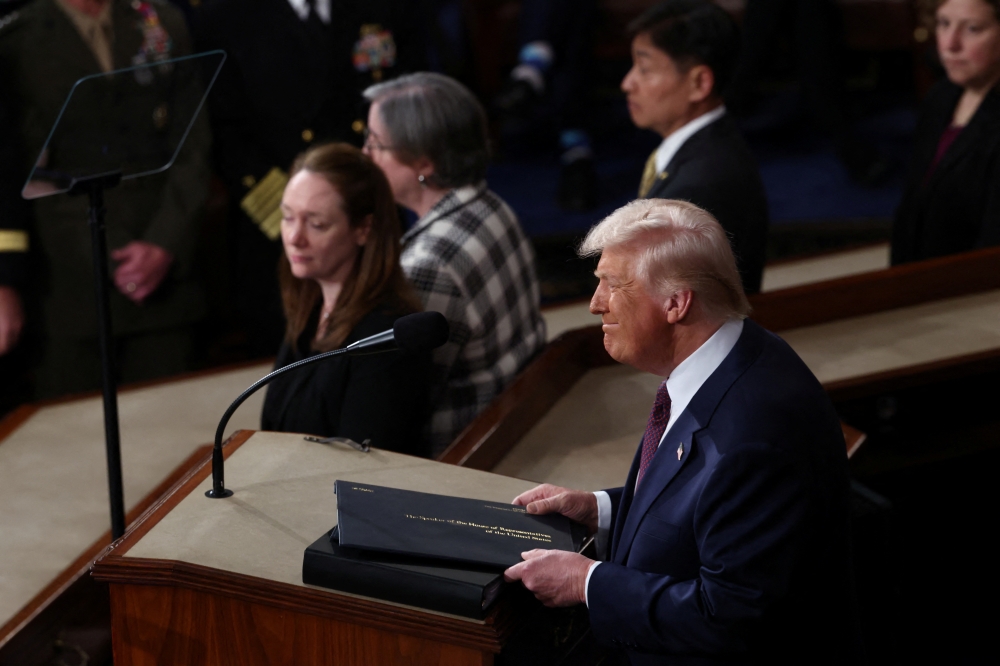 U.S. President Donald Trump's reacts during a joint session of Congress
