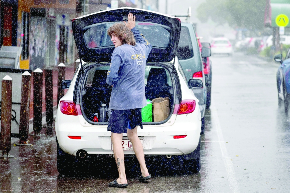 A resident packs a car 