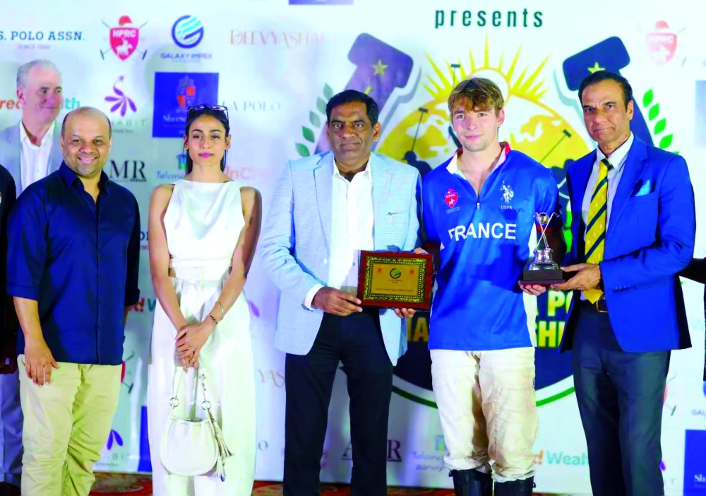 Most valuable player (MVP) award to French polo player Edwin Robineau, a member of the winning team-in world arena polo championship 2025, award given by Suresh Khandelwal Owner & Chairman Galaxy Impex , on the left Chaitania Kumar, President of HPRC. — Snaps India
