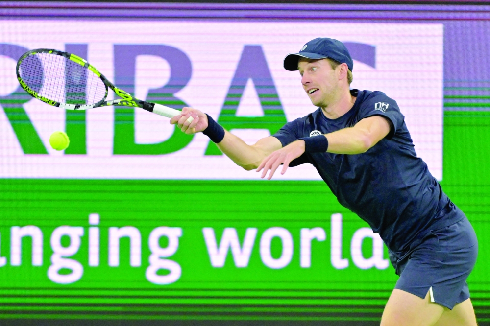 Botic Van De Zandschulp (NED) hits a shot against Nick Kyrgios (AUS) during his first round match of the BNP Paribas Open at the Indian Well Tennis Garden. 