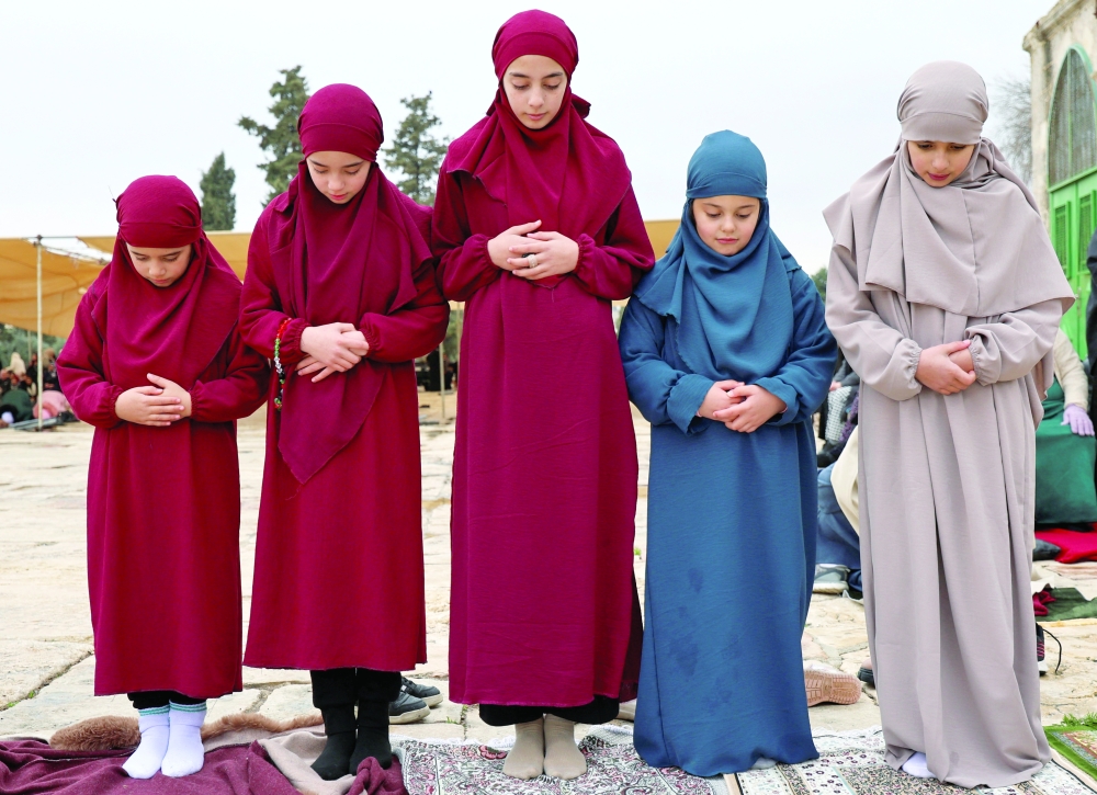 Worshippers attend the first Friday prayers of Ramadhan in Al Aqsa compound in Jerusalem's Old City. — Reuters