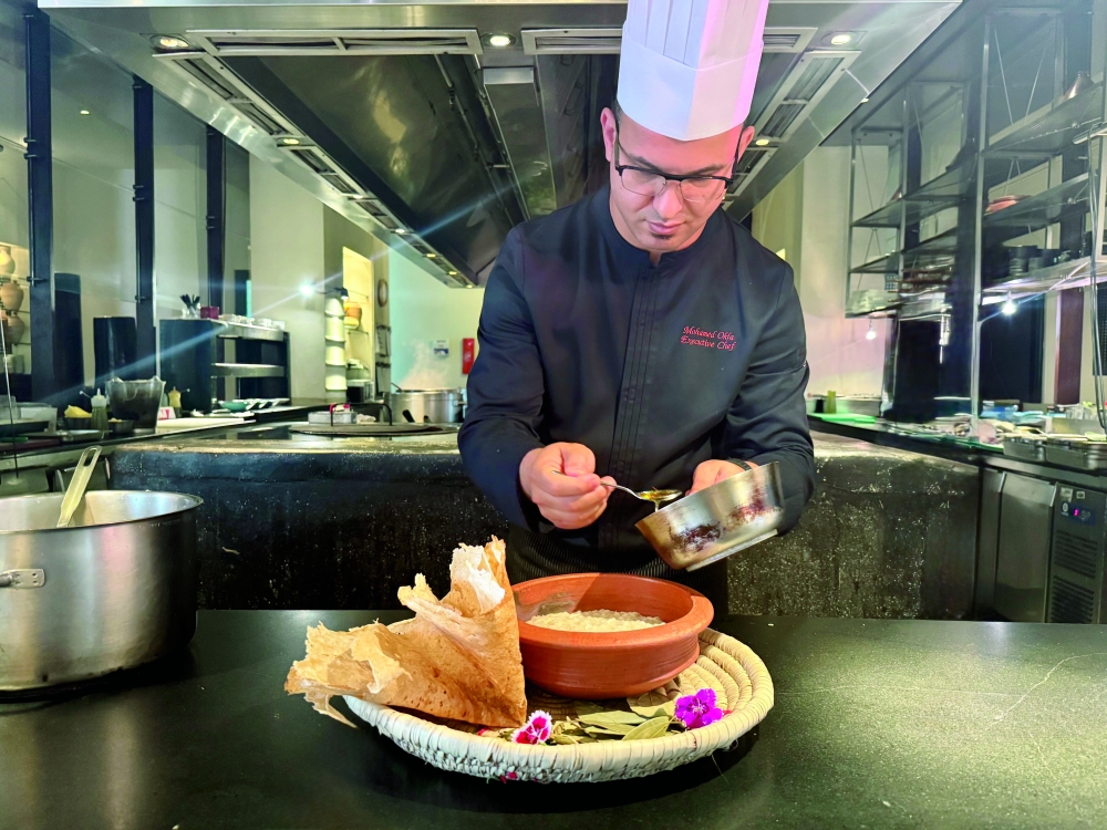 Executive Chef Mohamed al Okla preparing Harees with drizzle saffron-infused ghee