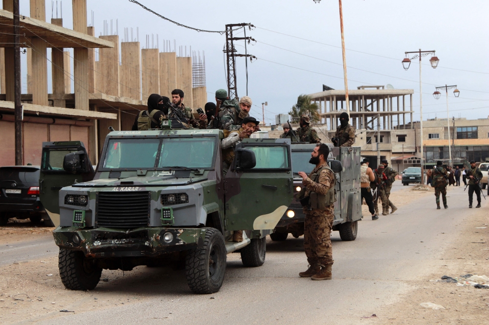 Members of Syria's new authorities security forces gather in Sanamayn, in the southern province of Daraa. — AFP file photo
